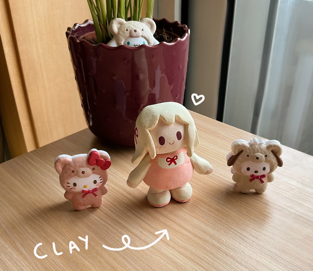 Clay doll next to sanrio characters