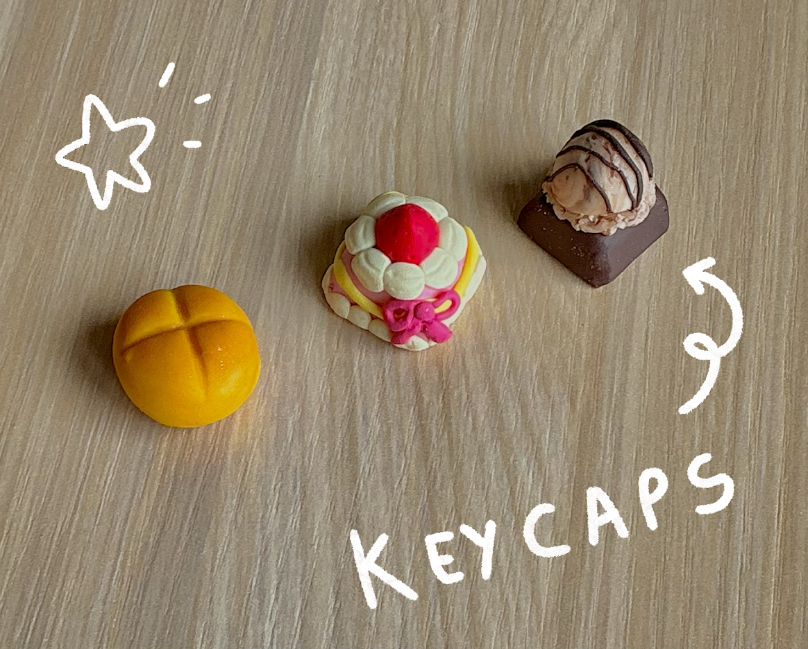 Polymer clay keycaps resembling a pink cake and a brown ice cream scoop